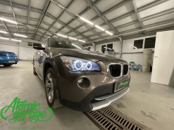 BMW X1 E84, линзы Hella 3r + новые лампы D1S Osram + замена Angel Eyes
